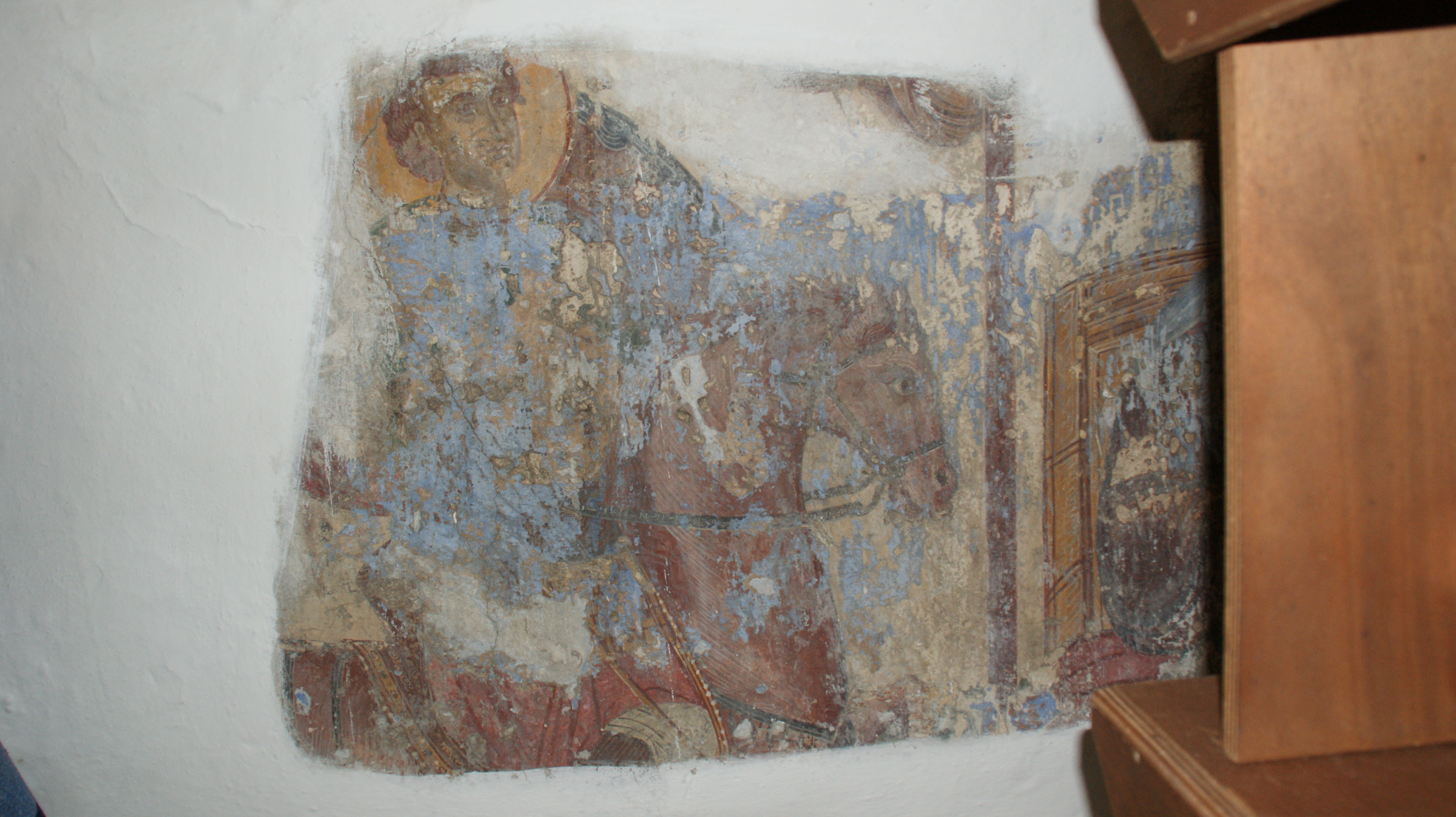 The depiction of the equestrian military saint, north wall (naos), St. Dimitrios tou Ambeliou, Symi (source: M. Asfentagakis).