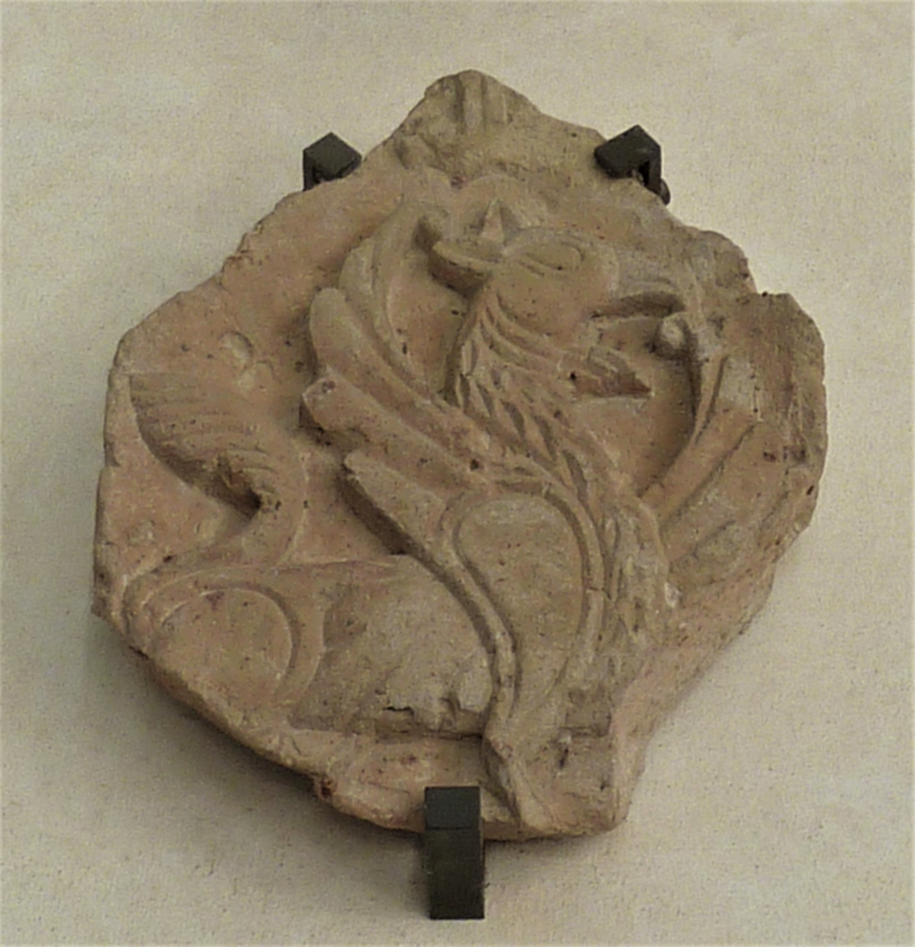 Ravenna, National Museum, part of a cuspidated formella with griffin from Sant’Adalberto in Pereo (source: Direzione Musei Emilia-Romagna)